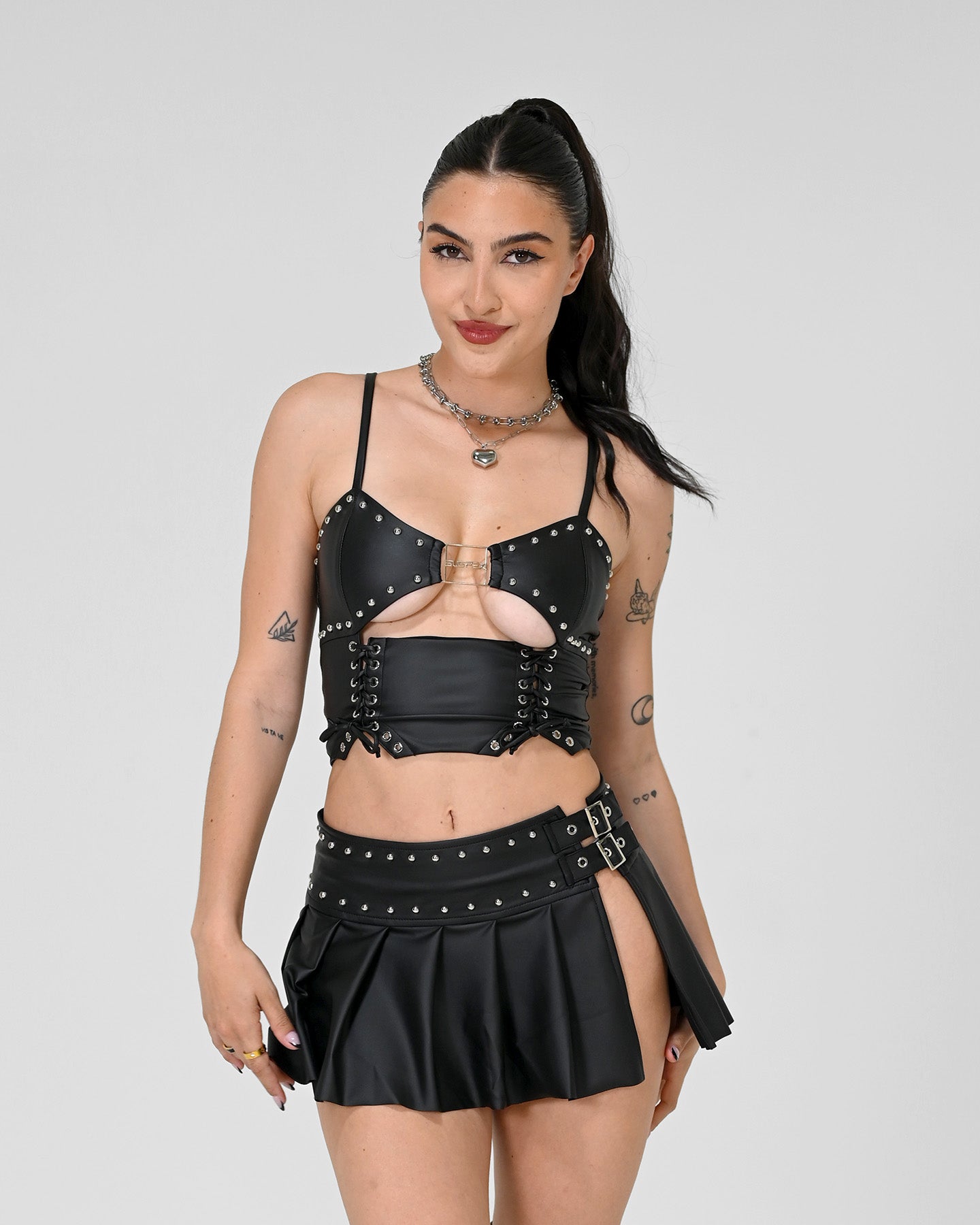 Black cropped corset-style rave tank with lace-up sides and stud detailing