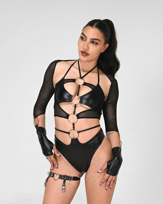 All-black 4-ring cutout rave bodysuit in vegan leather and mesh with adjustable ties