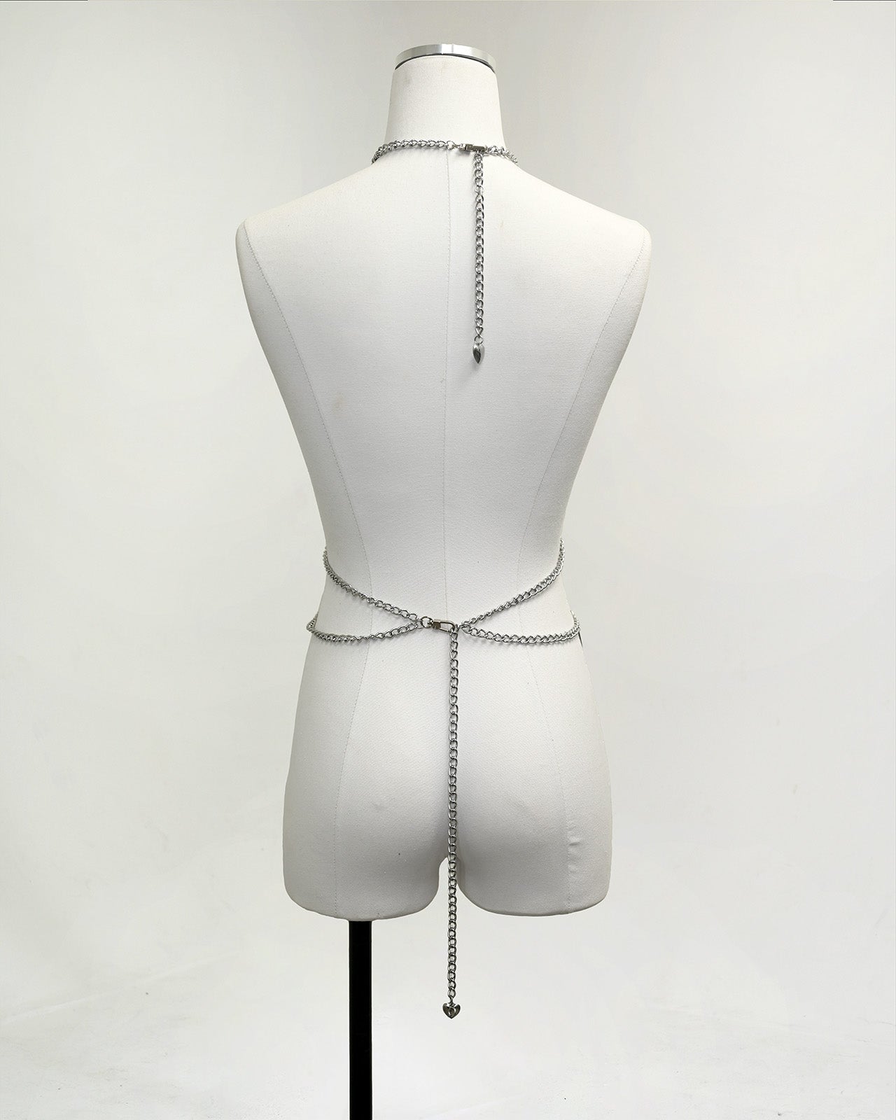 Silver Heartbreaker body chain harness with bubble-heart charms and spike-cone accents