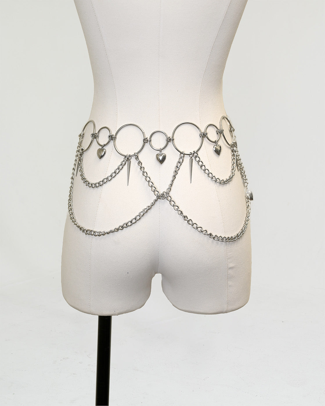 Silver Heartbreaker waist chain belt with bubble-heart charms and spike-cone details