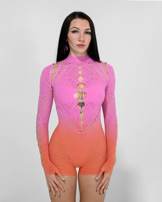Pink-to-orange gradient rave romper with cutouts, open shoulders and open back